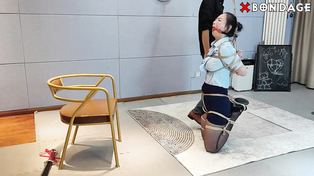 Chinese Bondage - Babe in black pantyhose tied up