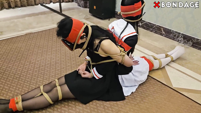Chinese Bondage - Two cuties are tied together