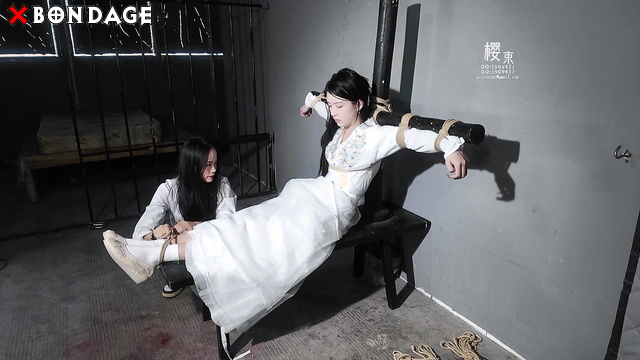Chinesse Bondage - The girl is tied to the cross