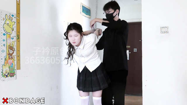 Chinesse Bondage - Schoolgirl handcuffed