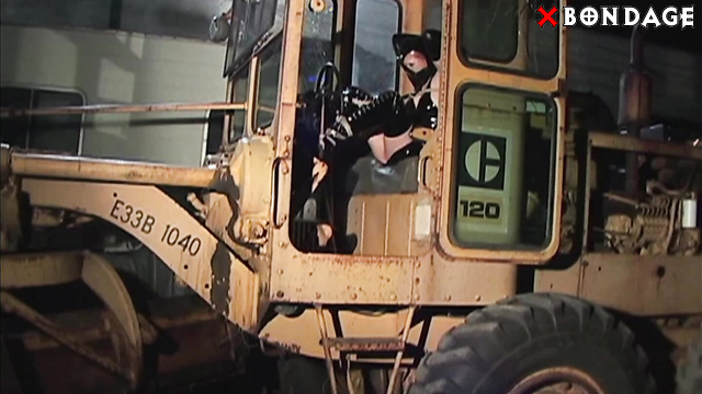 Rubber And Bondage - Sexy Latexed Brunette Tied Up in a Tractor