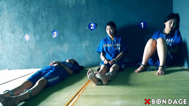 Chinese Bondage - Asian Barefoot Prisoners Cuffed in Shacles