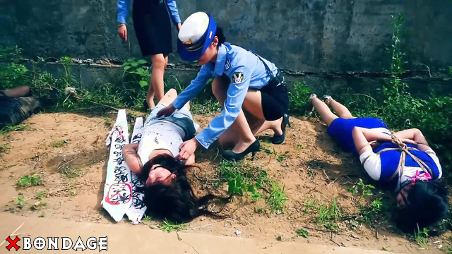 Chinese Bondage - Sexy Asian Brunettes Kneeling Chained in Prison