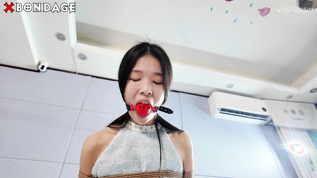 Chinese Bondage - A Hot Skinny Asian Brunette Tied to a Chair