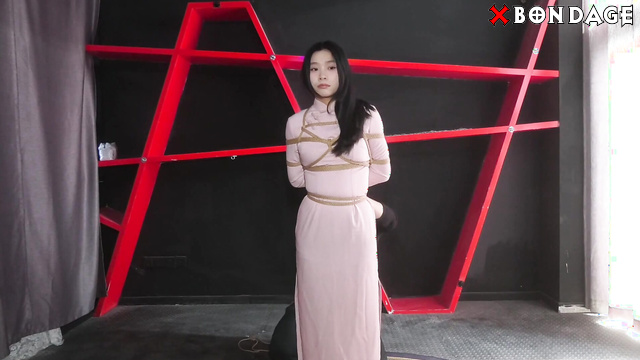 Chinese Bondage - A Beautiful Asian Girl Suspended in Shibari Bondage