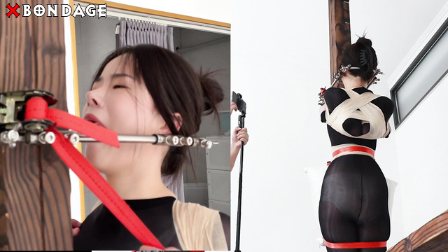 Chinese Bondage - An Awesome Asian Brunette Attached to a Pole