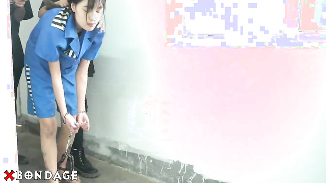 Chinese Bondage - Sexy Asian Brunette Hogcuffed in Prison