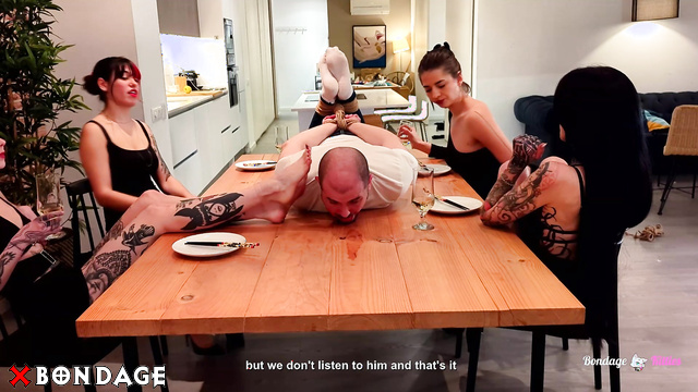 Bondage Kitties - Four Elegant Women Enjoy Dinner With Tied Slave On The Table