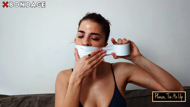 Bondage Kitties - Brigi Ties Herself Up with White Tape For Self-Bondage
